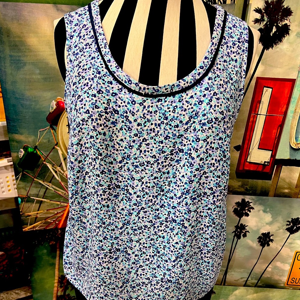 Sleeveless floral top with ribbon trim, from England